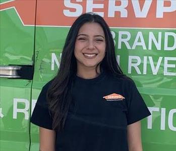 Employee in front of service truck