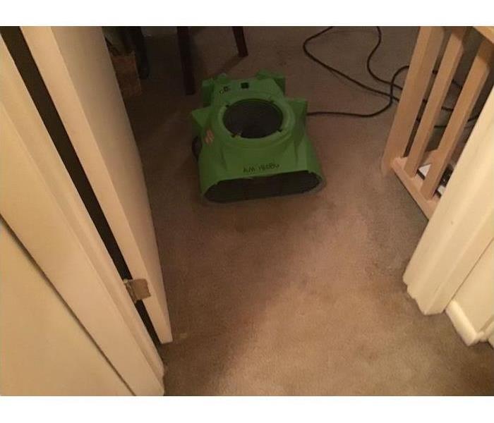 Wet carpet with drying equipment
