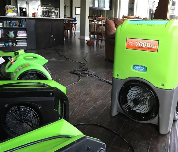 SERVPRO equipment on the floor in a kitchen. 
