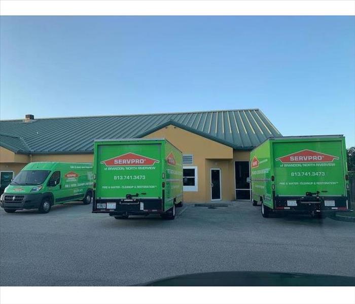 SERVPRO vehicle parked in front of building